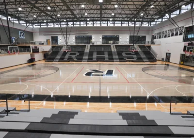 BROC Athletic Product Solution gymnasium black and grey bleachers with maple floors