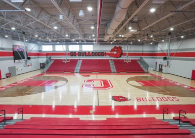 K-12 High School Telescoping Bleachers with red seat modules