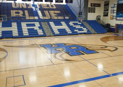 BROC high school telescoping bleachers blue with seat lettering