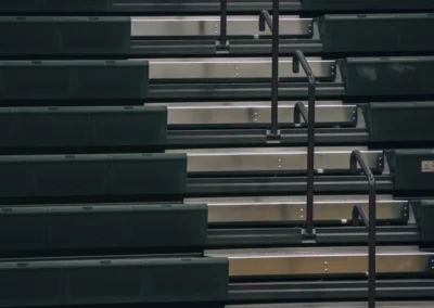 Telescoping bleachers with green seat modules