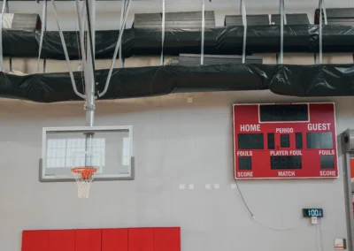 K-12 school gymnasium sport equipment. retractable basketball hoop, wall pad, wrestling mat hoist and scoreboard