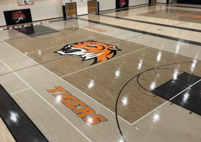 Gymnasium maple floors with orange tiger graphics