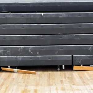 Example of loose and missing hardware in school gymnasium bleachers.